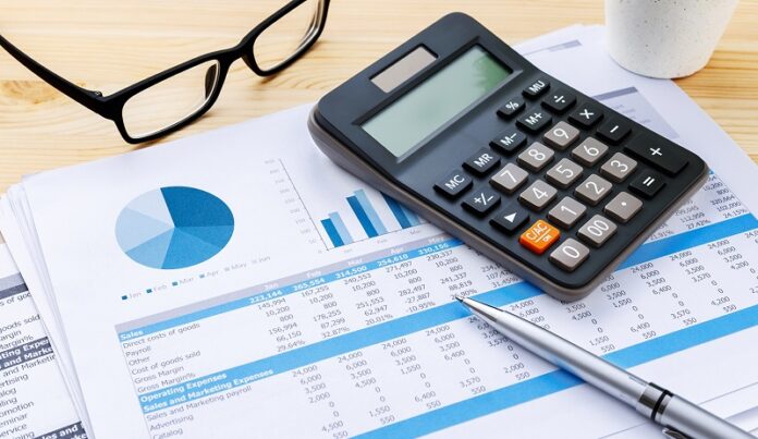 Financial chart with calculator and pen